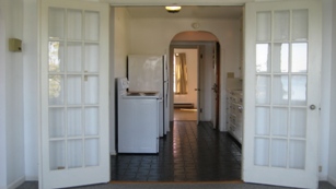 Kitchen looking South through kitchen to bedroom from dining room
